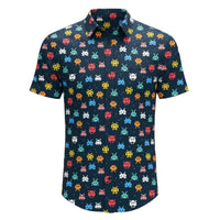 Project Good Apparel short-sleeve button-up shirt with a dark navy background and a pixelated Space Invaders pattern in various colors.
